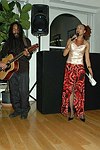 Miriam Chemmoss performs  at the People Reaching Out Holiday Charity Event at the private residence of David Larkin on 12-13-04 in Manhattan, N.Y. photo by Rob Rich copyright 2004<br>516-676-3939<br>robwayne1@aol.com